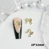 Joyería de aleación para uñas con forma de lazo de alta venta una variedad de accesorios decorativos para horquillas de uñas y pendientes estilo lujo ligero en oro y plata materiales