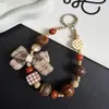 Correa para teléfono cuadrada con lazo de cuadros estilo coreano llavero hecho a mano con cuentas accesorio para bolso modelo nuevo