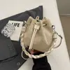 Bolsa de saco de cordão trançado de grande capacidade transfronteiriça para mulheres, nova bolsa de mão versátil para o dia a dia primavera-verão 2026, bolsa de ombro e transversal