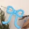 Nuevas decoraciones de globos con forma de lazo de corazón para crear un ambiente sofisticado de estilo coreano en cafeterías y pastelerías, perfectas para celebraciones de cumpleaños