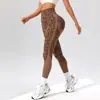 Pantalones de yoga con estampado de leopardo europeos y americanos transfronterizos, de punto de cintura alta, control de abdomen, moldeadores de glúteos tipo durazno, leggings deportivos de fitness y yoga para mujer
