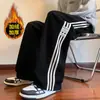 Pantalones de chándal Estilo Nuevo Otoño/Invierno 2024 para Hombre Tendencia Europea Algodón Terciopelo Pantalones Casuales para Hombre Rectos Largos Pantalones Pesados de Tres Rayas