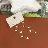 Pendientes Minimalistas de Oro con Borla de Corazón Pendientes de Alto Valor Nuevo Estilo 2025 Adelgazantes Elegantes Tendencia de Nicho