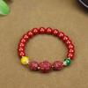 Pulsera de cinabrio rojo al por mayor con alto contenido de arena de oro púrpura de 8 m de cuentas redondas con colgante pulsera de la paz golondrina bestia valiente viva