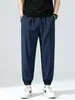 Fábrica de comercio exterior selecciona cuidadosamente pantalones jogger de seda helada, pantalones deportivos casuales de verano finos de secado rápido, pantalones de nueve puntos holgados para hombre