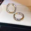 Brincos Circulares de Zircônia com um Estilo Europeu e Americano Único, Apresentando um Design de Alto Padrão, Luxo Leve e Nicho