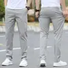 Calça casual masculina de algodão stretch em liquidação calça de algodão masculina reta folgada para negócios tamanho plus calça com forro de fleece outono e inverno