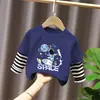Camiseta de manga larga de algodón puro para niño 2026 primavera y otoño nueva elegante de dibujos animados estilo dos piezas falsas camiseta base de primavera para niño