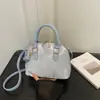 Bolso de mano de concha de perla, color sólido, simple, moderno, a la moda, de nicho, casual, elegante, bolso de hombro cruzado, nuevo modelo de verano