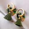 Nuevo pendiente de borla con forma de abanico de gota de aceite de esmalte verde retro chino, temperamento de lujo ligero, sensación de alta gama, pendientes multi-uso