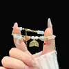 Nuevo Pulsera de Borla con Cuentas de Estilo Chino, Exquisita y a la Moda, de Nicho, Bidimensional, Lujo Ligero, Versátil, Apilable, Pulsera de Cuentas Impresionantemente Hermosa