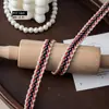 Venta directa de fábrica: Cinta de algodón de tres colores de 1,3 cm estilo Chanel no elástica, adorno para ropa y equipaje DIY, cinta de algodón de color contrastante