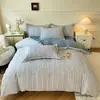 Conjunto de cama de quatro peças em algodão escovado espesso, perfeito para o calor do inverno, apresentando um estilo de luxo leve em algodão puro