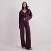 Ropa de mujer transfronteriza europea y americana 2026 otoño e invierno nuevo conjunto casual de dos piezas con pantalones largos de manga larga y cuello en V cruzado de color liso que ajustan la cintura