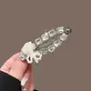 2026 Nuevo Clip para el Cabello Estrella Dulce Estilo Coreano Elegante Lazo de Perla Accesorio Versátil de Gama Alta para el Lado
