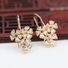 Pendientes de aguja con forma de flor de circón y diseño de rayo dorado de color cobre bañado en oro de Yiwu, hechos a mano, B2452