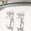 Xigu E1600 plata S925 elegantes aretes de lazo aretes de diseño de nicho simples frescos dulces femeninos