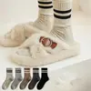 Calcetines de rayas retorcidas estilo universitario japonés para mujer, calcetines hasta la mitad de la pantorrilla, calcetines de lana engrosados y cálidos para otoño e invierno, calcetines retro holgados