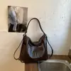 Bolsa de dumplings de gran capacidad para mujer, nuevo diseño de nicho vintage 2026, bolso de hombro cruzado, mochila multifuncional
