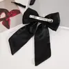 2025 Novo Estilo Presilha de Cabelo com Laço de Pérola Cetim Elegante Moda Doce Acessório de Cabelo para Meninas Atacado Atacado para Feiras
