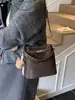 Bolso Pequeño Retro de Gama Alta para Mujer 2025 Nueva Moda Bolso Cruzado Versátil Bolso de Mano Súper Popular Bolso Cubo