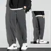 Pantalones de hombre marca de moda ins todo-partido pantalones deportivos primavera, otoño e invierno holgados con tobillo fruncido forro polar cálido casual pants de chándal
