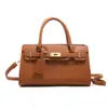 Bolso de Mano con Patrón de Lichi Transfronterizo para Mujer 2026 Nuevo Bolso de Hombro Cruzado de Moda Europea y Americana Elegante Bolso Kelly para Viajes Diarios para Mujer