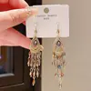 Pendientes de Borla de Gota de Cristal Incrustados de Diamantes de Lujo Ligero Estilo Étnico Retro Gama Alta Nicho Pendientes de Temperamento Exquisito