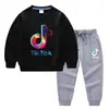 Conjunto de Ropa Infantil Transfronterizo Nuevo Primavera y Otoño 2026: Conjunto de Dos Piezas para Niños: Sudadera y Pantalón Largo, Atuendo de Algodón de Manga Larga de Color Sólido para Bebés