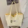Bolsa de Ombro Casual Listrada com Letras Transfronteiriça para Mulheres 2026 Nova Grande Capacidade Bolsa Tote Versátil de Dupla Face para o Dia a Dia