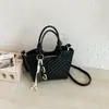 Bolso tejido para mujer, novedad primavera 2026 versión coreana, bolso cruzado de diseño nicho, bolso de hombro versátil de alta gama