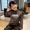Ropa interior térmica casual de forro polar para niños Otoño e Invierno 2026 Nuevo Estilo Cálida de Manga Larga con Cuello Semialto Camiseta Versátil para Niños