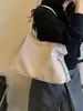 Bolsa tejida de gran capacidad para mujer, nuevo modelo 2026, bolso de hombro de nicho de alta gama, bolsa de mano casual de moda