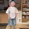 Camiseta de Manga Corta para Niños Ropa de Verano para Niños 2026 Nuevo Delgado Blanco con Letras Cuello Redondo Conjunto de Shorts de Mezclilla