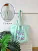 Bolsa Coreana de Nailon Dopamina Doble Cara Estilo Perezoso Rayas de Colores Estampado de Letras Simple Bolsa para Estudiantes y Viajeros