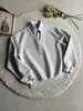 Sudadera de alta calidad con diseño intelectual de dos piezas, rayas, cuello en V, color liso, suéter corto ancho y holgado, top versátil estilo universitario