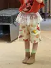 Verão 2026 Novo Estilo Coreano Infantil Bonito Shorts Estampados para Meninos e Meninas, Calças de Cinco Pontos Casuais da Moda com Graffiti Tendência