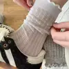 Calcetines de malla calada de color liso de moda estilo coreano ins hasta la mitad de la pantorrilla primavera verano estilo japonés chica calcetines arrugados de encaje finos simples