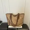 Bolso tote de hombro cruzado europeo y americano de gran capacidad para el día a día 2026 moda tejido personalizado moderno simple para mujer