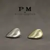 Botones metálicos de forma irregular con forma de arco, cosidos a mano, estilo minimalista, adecuados para trajes, abrigos, chaquetas, tops versátiles y prendas de punto.