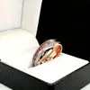 Moda Europea y Americana Transfronteriza Xiyin Fabricante de Fuente de Anillo de Acero Inoxidable Oro Rosa Astas de Ciervo + Flecha de Oro Rosa de Seda