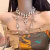 "Colección de Collares de Perlas de Múltiples Capas" Lujo Accesible y Diseño de Alta Gama Cadena para Suéter Moda Otoño e Invierno Versátiles Collares