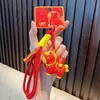 Llavero de Mascota Rojo Colgante para Bolsa de Año Nuevo Llavero de Pareja para Coche Día de Año Nuevo Pequeño Regalo Al por Mayor