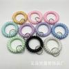 Pulsera de teléfono de línea espiral ancha elástica de plástico directo de fábrica, color gelatina, llavero con anillo de resorte, accesorios para pulsera de mano