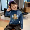 Ropa interior térmica para niños 2026 Nueva Ropa Otoño/Invierno Cuello Semi-Alto Camiseta de Manga Larga Cepillada para Niños Top Térmico de Felpa Tendencia