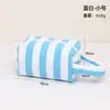Nova bolsa de maquiagem de grande capacidade para viagens transfronteiriças, bolsa de skincare listrada com design de alça portátil, bolsa de armazenamento para batom