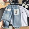 Ropa de primavera para niños 2025 nueva pantalones vaqueros de dibujos animados lavados a la arena para niños coreanos pantalones para niños venta al por mayor generación