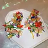 Pendientes de borla de flor de cuentas de color dopamina para primavera, sensación de lujo ligero y alta gama, pendientes atmosféricos estilo vacacional para mujer