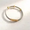 Nueva oferta especial: Pulsera de cable de acero de titanio de moda popular europea y americana, de alta calidad, que conserva el color, versátil, para hombres y mujeres