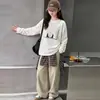 Camiseta casual de manga larga para niñas de principios de otoño 2026 estilo nuevo camiseta base blanca para niñas, top elegante de primavera y otoño para niños mayores
